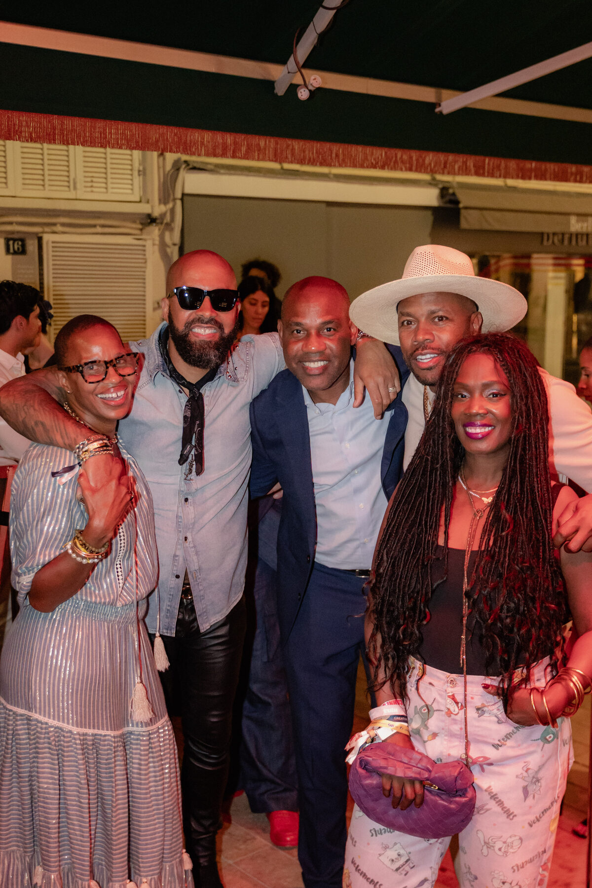 Group of guests embracing candidly at Cannes Lions 2024