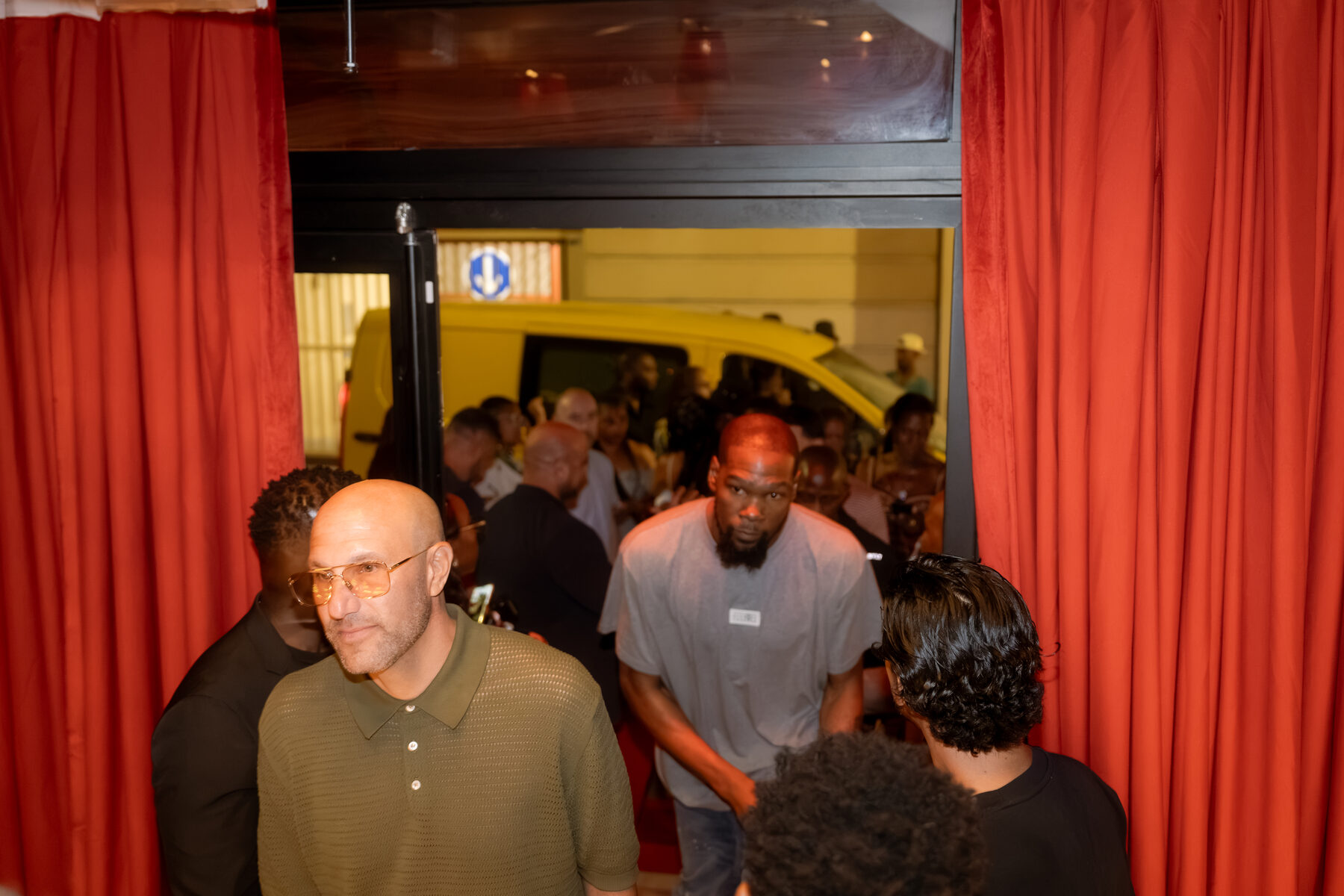 Guests arriving through the red curtained entrance in Cannes